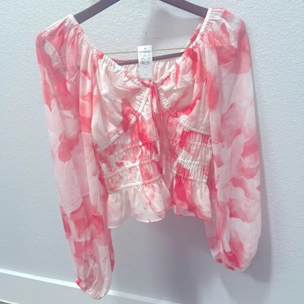 Express floral long sleeved blouse.